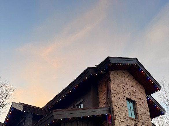 Twilight home with multicolor accent LED line on the eave