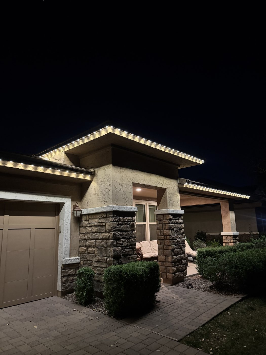 Crisp warm LED roofline outline at night