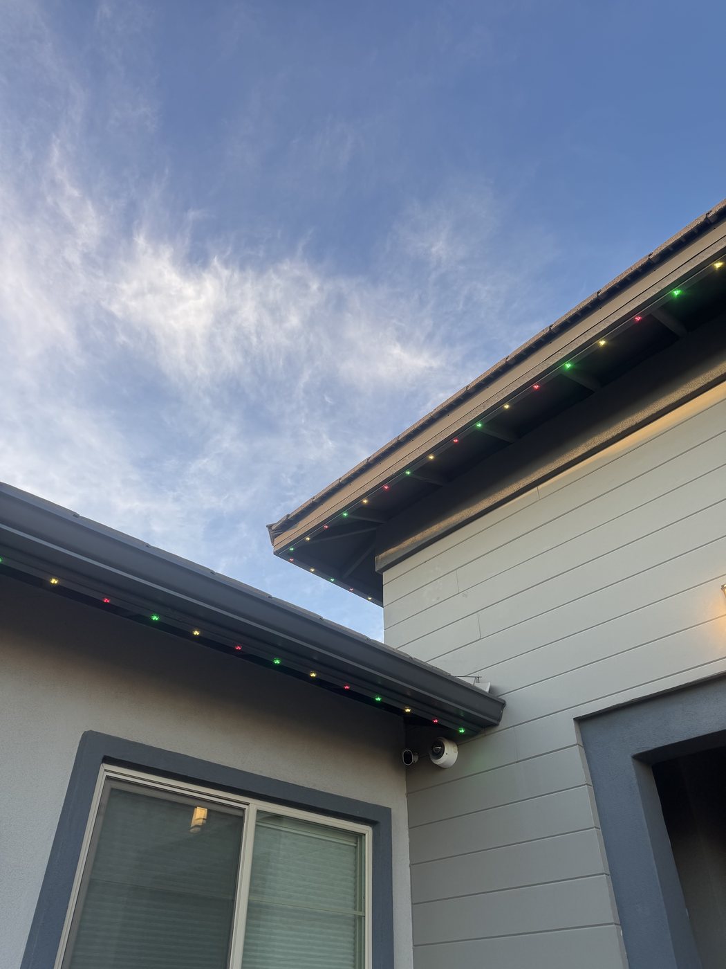 Gable peak with multicolor permanent LED line at twilight