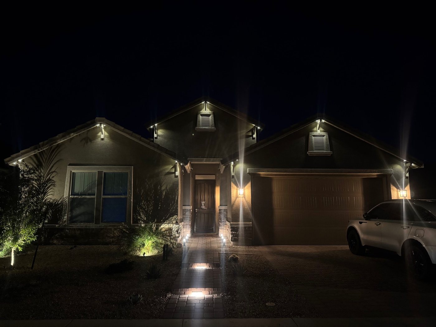 Residential roofline with warm white security lighting