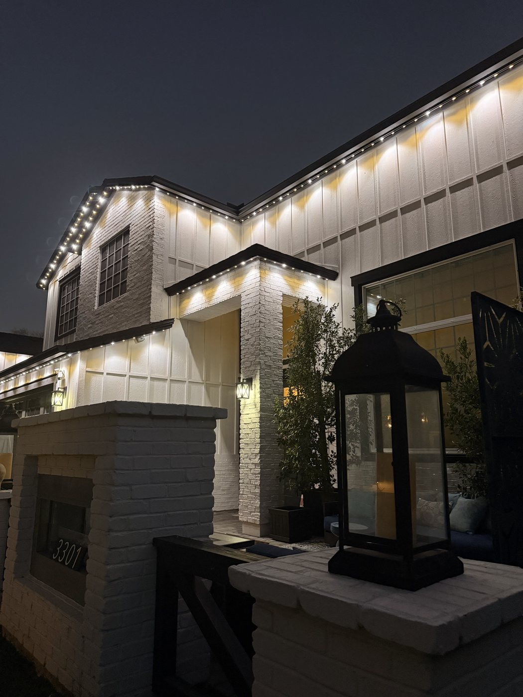 Stone-faced estate with permanent perimeter lighting